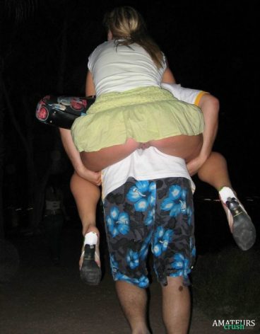 accidental upskirt while her friend lift her up on his back showing her rear pussy