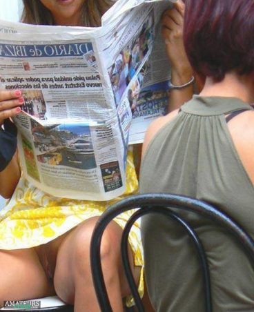 Sexy pussy slip in public of hot babe reading a newspaper