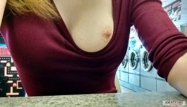 Boob out at public laundry room showing pink nipple
