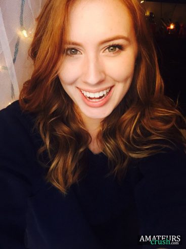 smiling beautiful ginger girl selfie in natural redhead