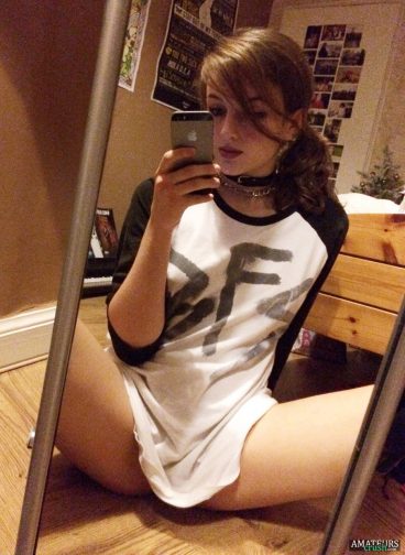 Cute goth teen opening her legs in front of the mirror selfie covering just her pussy