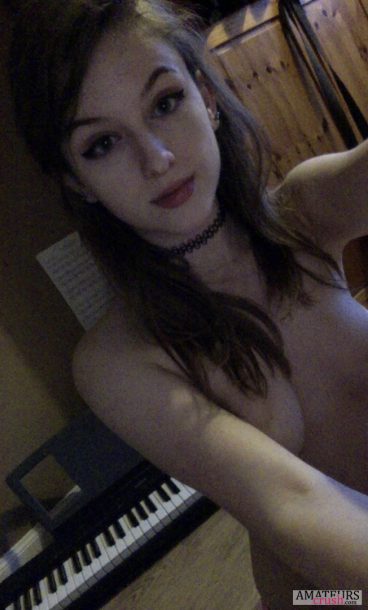 Hot slutty selfie of nude teen covering her tits with her arms in selfshot