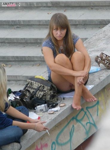 Caught while taking a candid upskirt pic of a college girl sitting on the ledge with her legs up