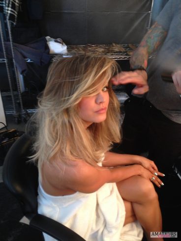 Kaley Cuoco getting her hair done by a stylish pic